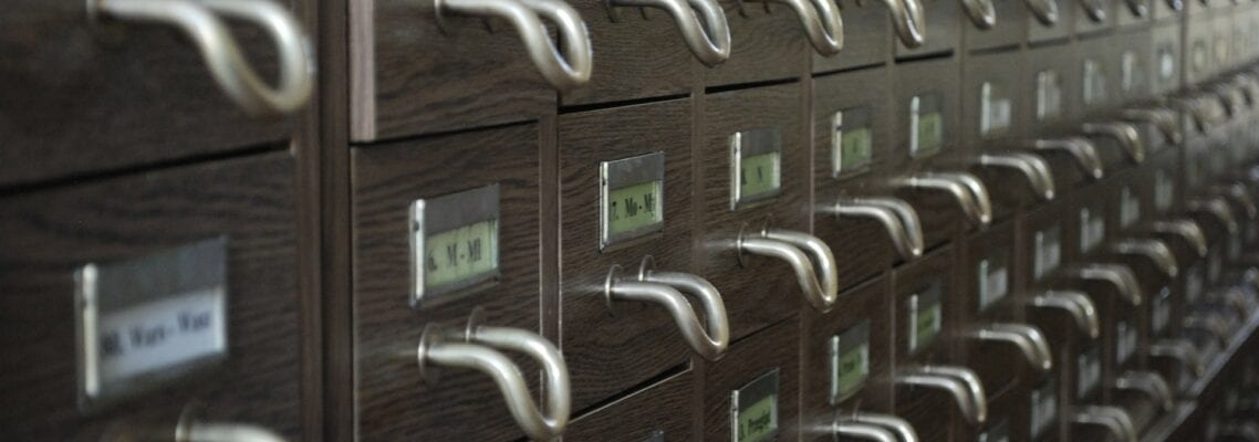 A wall of filing cabinets with numbers on them.