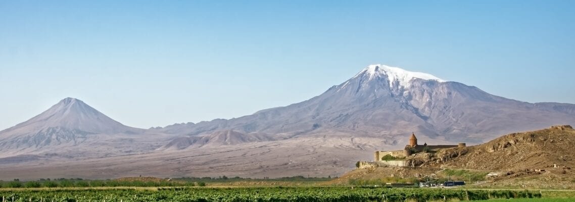 A large mountain with snow on top of it.