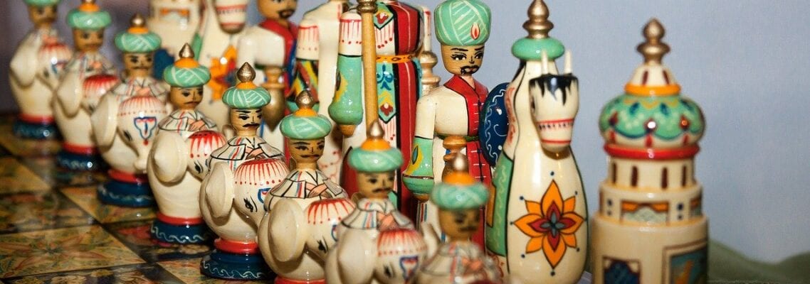 A group of chess pieces on top of a table.