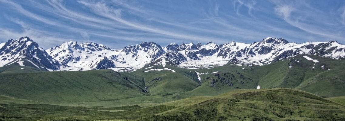 A large mountain range with snow on top of it.