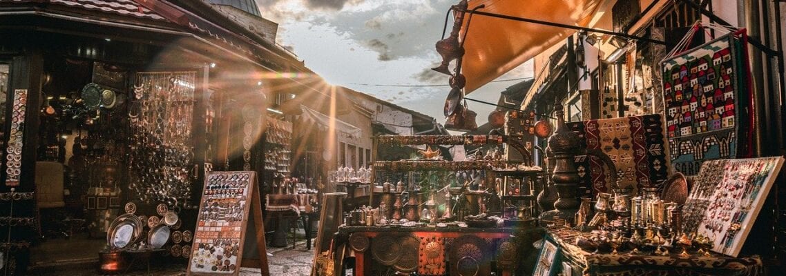 A street with many shops and tables on it