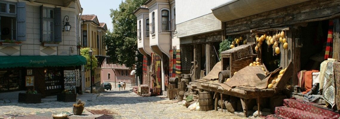 A street with many buildings and trees