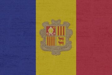 A flag of andorra with the coat of arms on it.