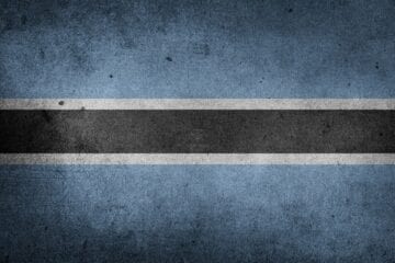 A blue and black striped background with white lines.