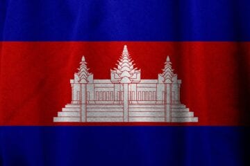 A flag of cambodia with the image of an asian temple.