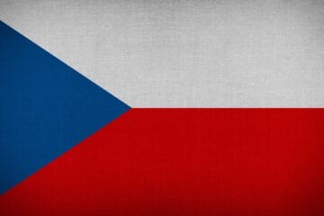 A flag of the czech republic with a red, white and blue background.