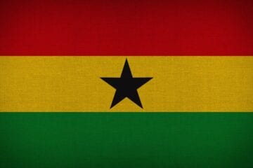 A flag of ghana with the black star on it.