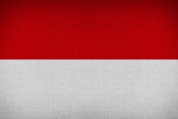 A red and white background with the flag of indonesia.