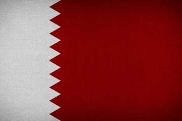 A red and white flag with the middle east on it.