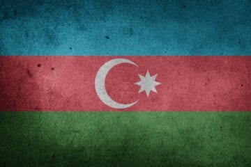 A flag of azerbaijan with a blue and green background.