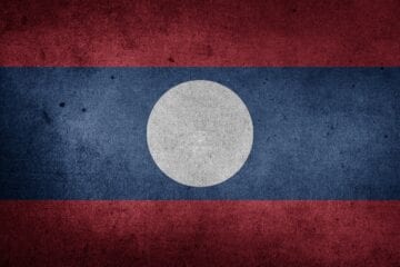 A flag of laos painted on the wall.