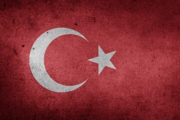 A flag of turkey with a star and crescent on it.