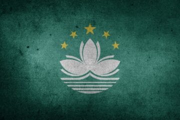 A green background with the macau flag on it.