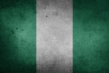 A green and white flag with the word nigeria on it.