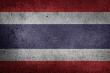 A red, white and blue flag with the thai flag on it.