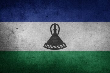 A flag of lesotho painted on the wall.