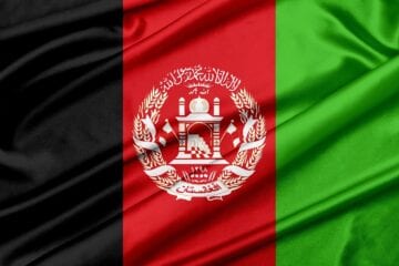 A flag of afghanistan with the colors red, black and green.