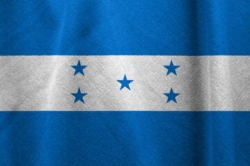 A blue and white flag with five stars.