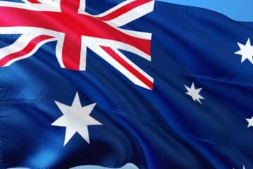 A flag of australia is waving in the wind.