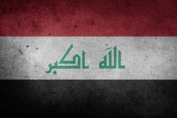 A flag of iraq with the word " iraq " written in it.