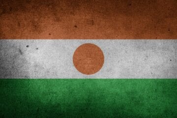 A flag of niger painted on the wall.