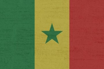 A flag of senegal with a star on it.