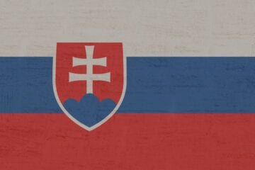 A flag of slovakia with the coat of arms on it.