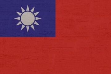 A red and blue flag with the sun in the middle.