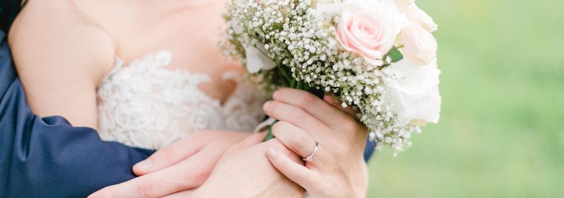 A close up of a person holding flowers